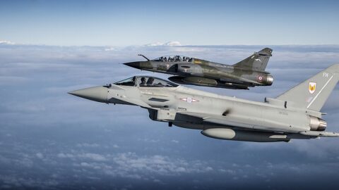 An RAF Typhoon flying alongside a French Mirage