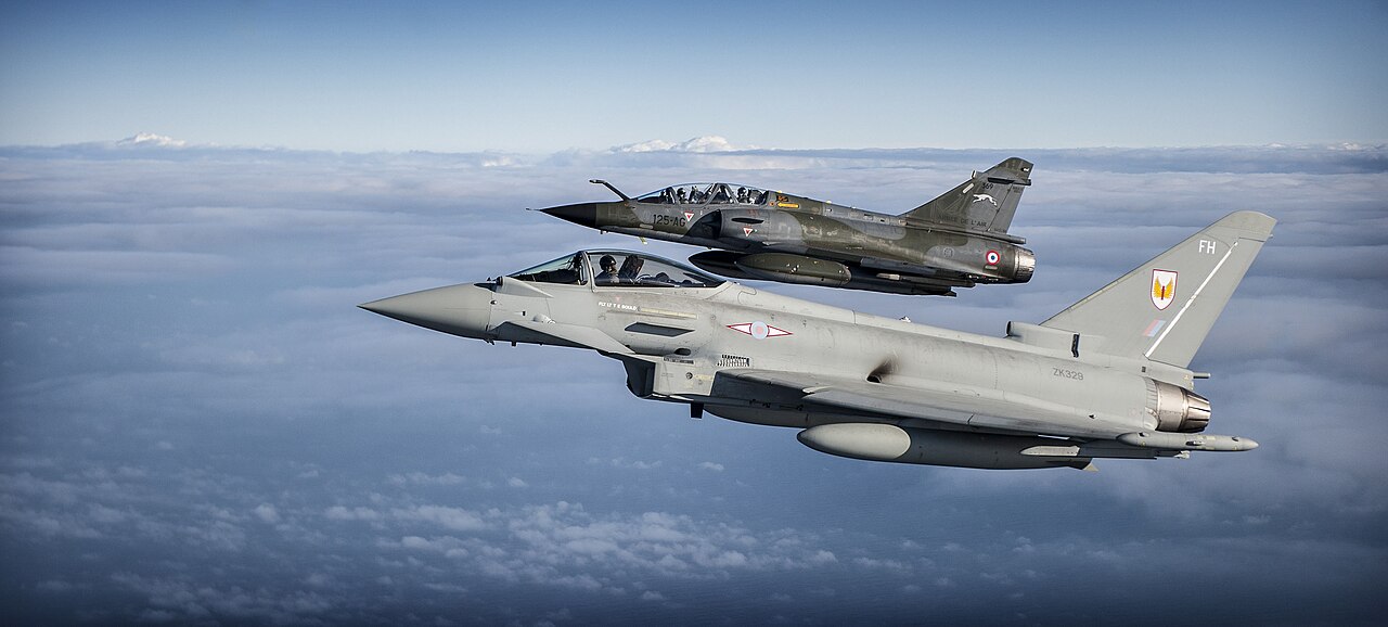 An RAF Typhoon flying alongside a French Mirage